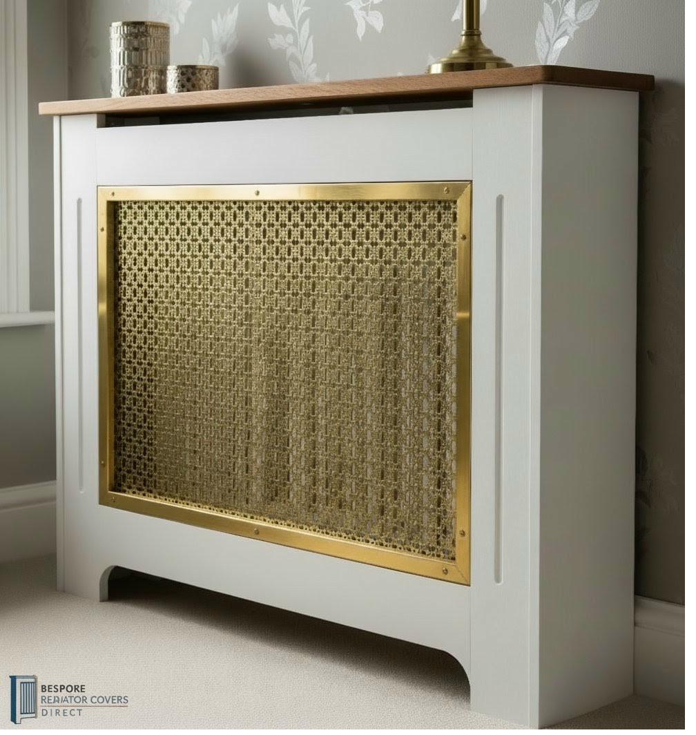 Premium white radiator cover with woven brass mesh grille in a brass frame and solid oak shelf top
