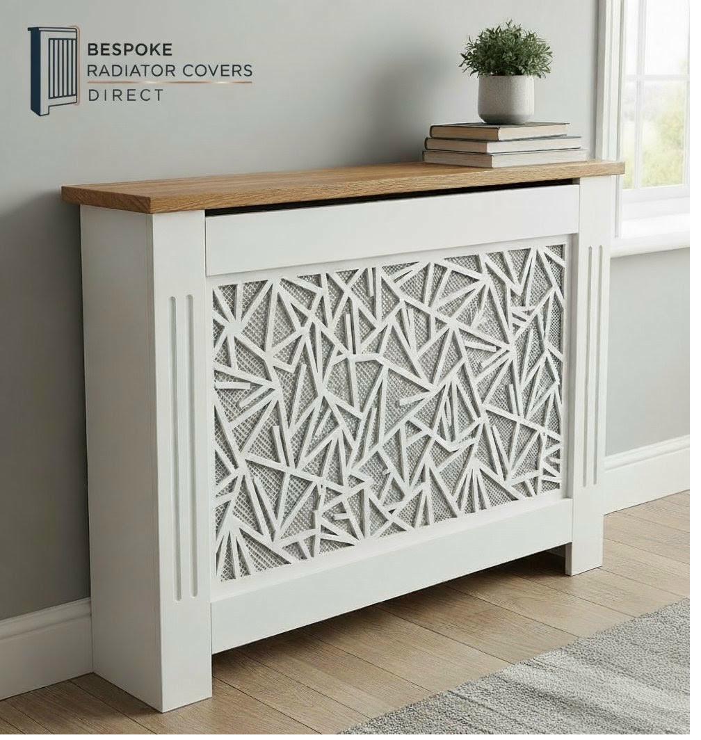 White bespoke radiator cover with geometric bamboo-inspired angular triangular cutout pattern and solid oak shelf