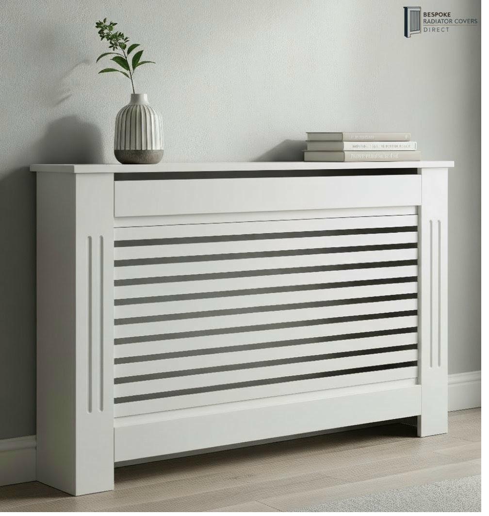White horizontal louvre slat radiator cover with framed panel detail and vase on top